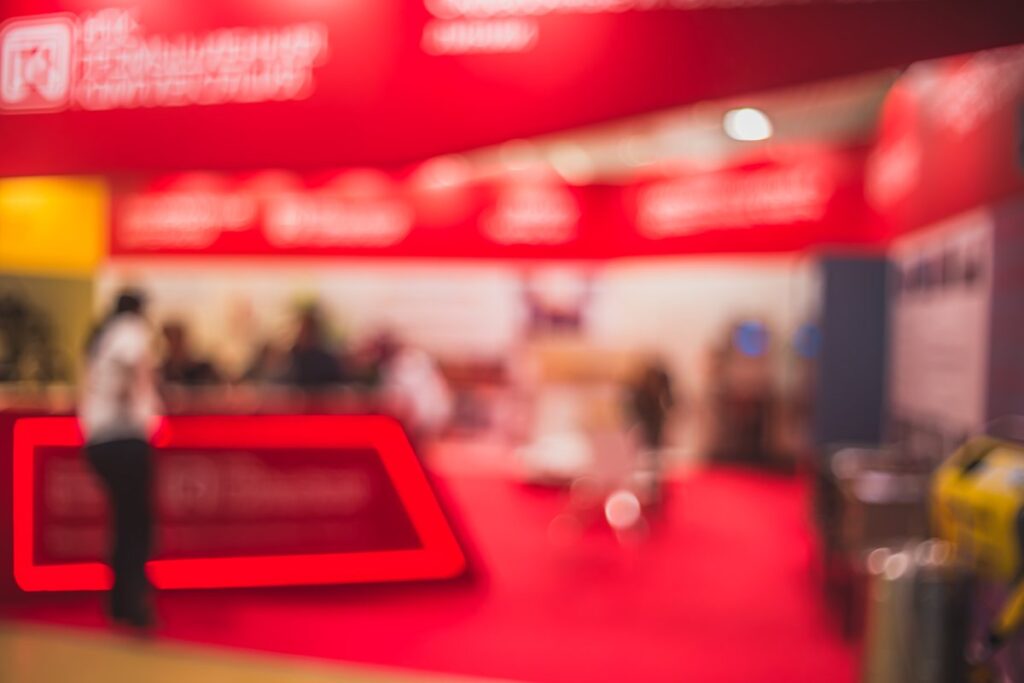 Trade show floor with stands and visitors at an international trade fair